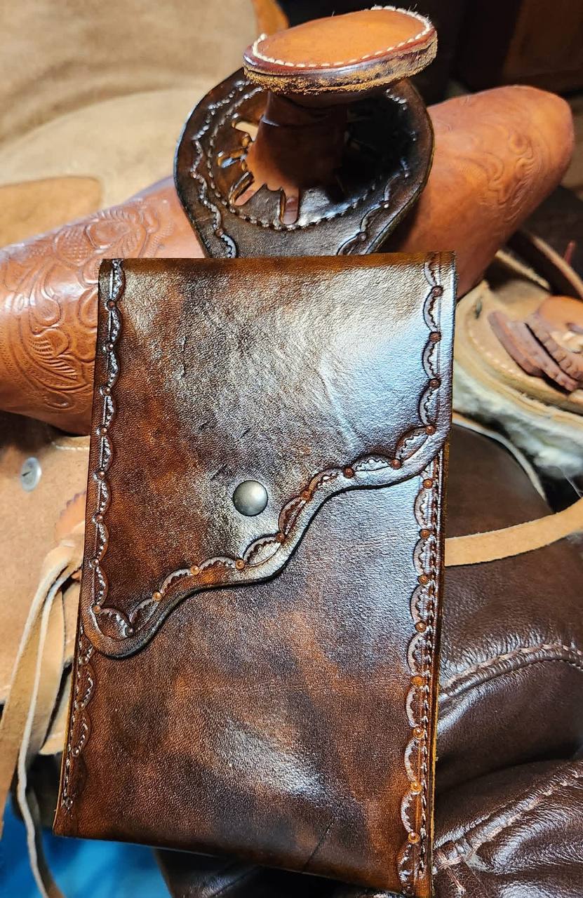 Handmade dark brown leather pouch with tooled edge detail